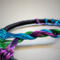 details of braided tree trunk shown from the side alonf with multicolor roots